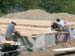 0027 - construction crew measuring floor joists